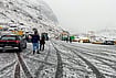 In Photos | Fresh Snowfall Brings Early Winter Chill To Himachal Pradesh And Kashmir | Photo: PTI : Tourists arrive at the North Portal of the Atal Tunnel amid fresh snowfall, in Kullu district, Himachal Pradesh, Thursday, Oct. 15, 2026.