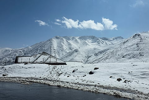 View of a snow-laden valley on Mughal Road following fresh overnight snowfall, in Shopian district, Jammu and Kashmir, Thursday, Oct. 15, 2026. 