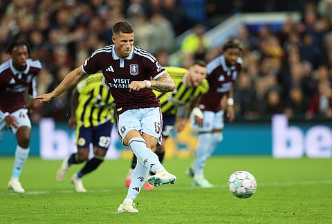 Aston Villa's Ross Barkley shoots a penalty to score his sides' fourth goal during the Champions League opening phase soccer match between Aston Villa and Fenerbahce in Birmingham, England, Wednesday Oct. 14, 2026. 