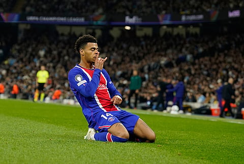 PSG's Desire Doue celebrates after scoring his side's opening goal during the Champions League opening phase soccer match between Manchester City and Paris Saint-Germain in Manchester, England, Wednesday, Oct. 14, 2026. 
