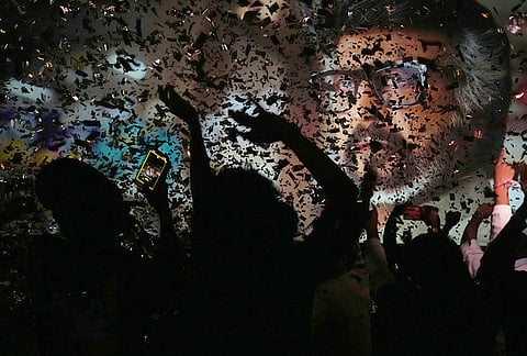 Fans of Indian superstar Rajinikanth cheer as they celebrate a screening of his latest film, "Jailer 2," at a cinema hall in Mumbai, India, Thursday, Oct. 15, 2026. 