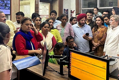 Police personnel detain parents of 19-year-old Ankita Bhandari, who was murdered in Uttarakhand in 2022, while protesting near India Gate against Dushyant Kumar Gautam’s appointment as Sikkim governor, in New Delhi. 