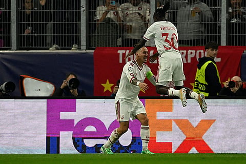 Liverpool's Jeremie Frimpong, right, celebrates with Kostas Tsimikas after scoring his side's fourth goal during the Champions League opening phase soccer match between LASK and Liverpool in Linz, Austria, Wednesday, Oct. 14, 2026.