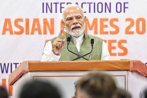 In this image posted on Oct. 15, 2026, Prime Minister Narendra Modi addresses an interaction programme with the athletes of the Asian Games 2026, in New Delhi.