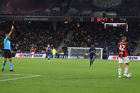 AC Milan's Filippo Terracciano receives a red card from the referee during an Europa League opening phase soccer match between FC Red Bull Salzburg and AC Milan, in Salzburg, Austria, Thursday, Oct.15, 2026.