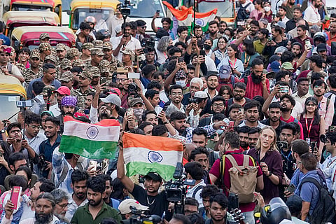 People participate in the 'Lehra Do Tiranga' protest march called by called by the Cockroach Janta Party (CJP) demanding the resignation of Chief Election Commissioner (CEC) Gyanesh Kumar over alleged irregularities in the Special Intensive Revision (SIR) of electoral rolls, at Connaught Place, in New Delhi, Friday, Oct. 16, 2026.