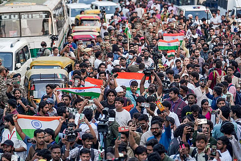 People participate in the 'Lehra Do Tiranga' protest march called by called by the Cockroach Janta Party (CJP) demanding the resignation of Chief Election Commissioner (CEC) Gyanesh Kumar over alleged irregularities in the Special Intensive Revision (SIR) of electoral rolls, at Connaught Place, in New Delhi, Friday, Oct. 16, 2026.
