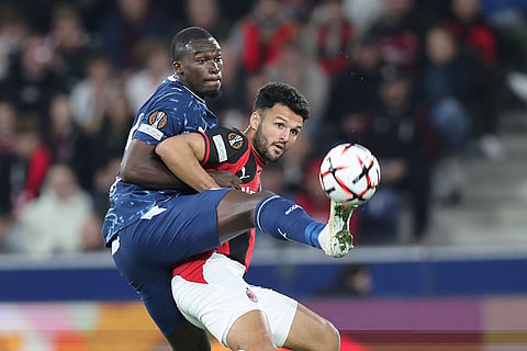 AC Milan's Goncalo Ramos fights for the ball with Salzburg's Kevin Boma during an Europa League opening phase soccer match between FC Red Bull Salzburg and AC Milan, in Salzburg, Austria, Thursday, Oct.15, 2026.