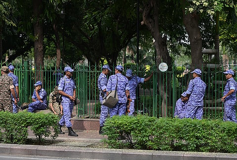 Security personnel keep a vigil ahead of the Cockroach Janta Party's proposed 'Lehra Do Tiranga' march at the Central Park in Connaught Place, in New Delhi, Friday, Oct. 16, 2026. 