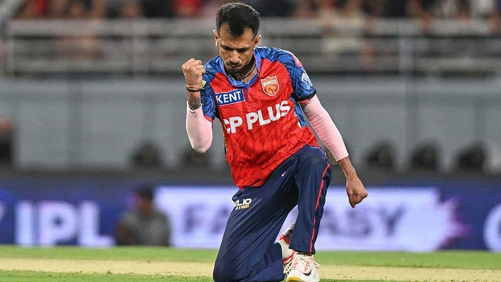 Punjab Kings' Yuzvendra Chahal celebrates the wicket of Rajasthan Royals' captain Riyan Parag during the Indian Premier League cricket match between Rajasthan Royals and Punjab Kings in New Chandigarh, India. - Photo: AP