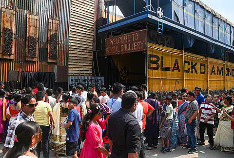 People visit the Thakurpukur SB Park Sarbojanin Durga Puja 'pandal' themed on coal mines on the fifth day of the festival, in Kolkata, Thursday, Oct. 15, 2026. 
