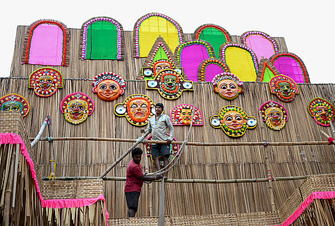 Workers prepare the ‘Durga Puja’ pandal, themed as “Tribals of the African Union” ahead of the festival, in Ranchi, Monday, Oct. 12, 2026. 