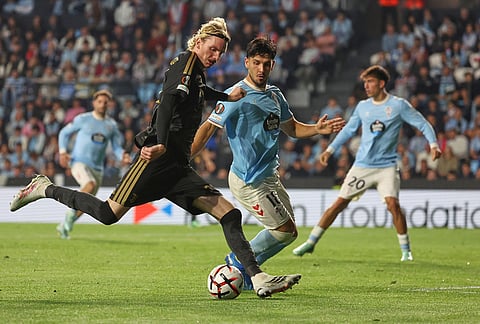 Juventus' Nick Woltemade, centre, kicks the ball ahead of Celta's Yoel Lago during the Europa League soccer match between Celta Vigo and Juventus in Vigo, Spain, Thursday, Oct. 15, 2026. 