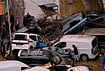 In Photos: Overturned Cars, Debris-Strewn Streets After Istanbul’s Deadly Floods | Photo: AP/Emrah Gurel : Local residents walk among toppled vehicles and scattered debris in the aftermath of floods caused by heavy rains, in Istanbul, Turkey, Thursday, Oct. 15, 2026.