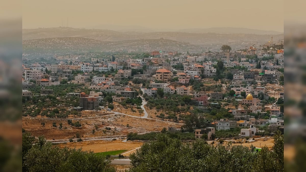 Dense residential buildings spread across the hills of Jenin in the northern West Bank of Palestine - Nayef Hammouri/Shutterstock