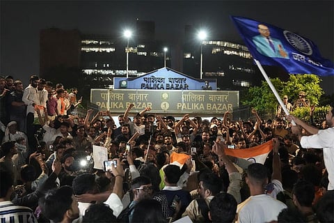 People participate in the 'Lehra Do Tiranga' protest march called by the Cockroach Janta Party (CJP) demanding the resignation of Chief Election Commissioner (CEC) Gyanesh Kumar over alleged irregularities in the Special Intensive Revision (SIR) of electoral rolls, at Connaught Place, in New Delhi, Friday, Oct. 16, 2026.