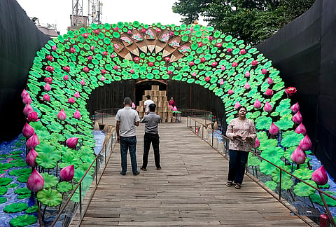 People at a lotus-themed community pandal, during the 'Durga Puja' festival, in Kolkata, West Bengal, Friday, Oct. 16, 2026. 
