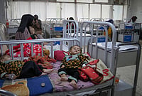 In Photos: Afghanistan Faces Rising Malnutrition Amide Crises And Cuts | Photo: AP/Siddiqullah Alizai : Afghan women care for their children in the malnutrition ward at Indira Gandhi children's hospital in Kabul, Afghanistan, Monday, Oct. 12, 2026.