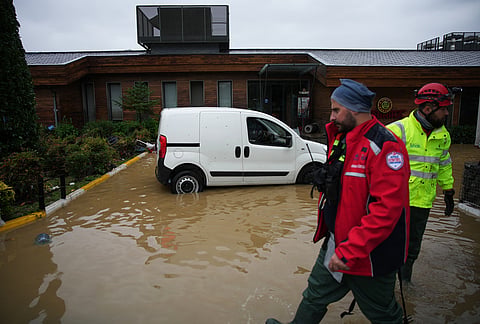 Emergency team members work in the aftermath of floods caused by heavy rains in Istanbul, Turkey, Thursday, Oct. 15, 2026. 