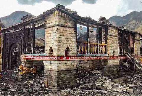 Premises of the Ma Bhagwati temple, an ancient wooden temple dedicated to Goddess Bhagwati, are seen damaged after a fire, at Badiyakot area in Bageshwar district, Uttarakhand, Friday, Oct. 16, 2026. 
