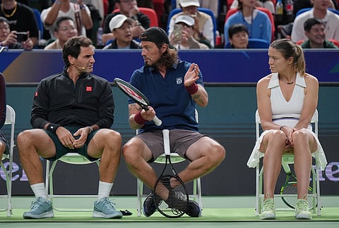 Former tennis players from left, Roger Federer, of Switzerland, Marat Safin and Dinara Safina, of Russia play at the Roger and Friends Celebrity Doubles Match with Chinese celebrities during the Shanghai Masters tennis tournament in Shanghai, China, Friday, Oct. 16, 2026. 