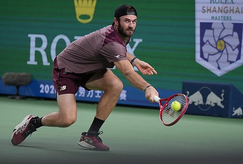United States' Tommy Paul returns a ball to Russia's Daniil Medvedev during the men's singles quarterfinals match at the Shanghai Masters tennis tournament in Shanghai, China, Friday, Oct. 16, 2026. 
