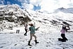 Fresh Snowfall At Zojila Pass In Photos: Tourists Enjoy Snow, Army Keeps Vigil | Photo: PTI/Burhaan Kinu : Tourists play with snow at Zero Point Zojila on the Srinagar-Leh National Highway, in Jammu and Kashmir, Saturday, Oct. 17, 2026.