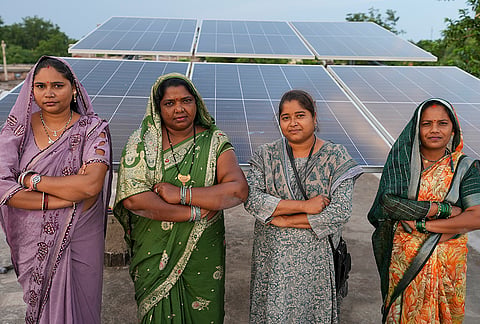 Members of a women’s self-help group, trained as solar vendors under the 'Bihan' initiative and PM Surya Ghar Muft Bijli Yojana, pose in front of rooftop solar panels, in Chhattisgarh. The state government led by Chief Minister Vishnu Deo Sai is creating new livelihood opportunities by encouraging rural women to become solar entrepreneurs. 