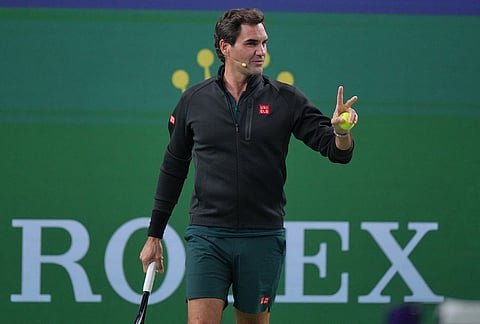 Former tennis player Roger Federer, of Switzerland plays at the Roger and Friends Celebrity Doubles Match with Marat Safin, former tennis player Dinara Safina, of Russia and Chinese celebrities during the Shanghai Masters tennis tournament in Shanghai, China, Friday, Oct. 16, 2026. 
