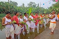 | Photo: PTI : People perform 'Kolabou Snan' rituals on the occasion of 'Maha Saptami' during the ongoing 'Durga Puja' festival, at Hatserandi village, in Birbhum, West Bengal.