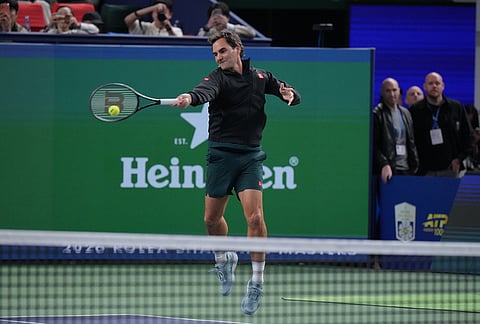 Former tennis player Roger Federer, of Switzerland plays at the Roger and Friends Celebrity Doubles Match with Marat Safin, former tennis player Dinara Safina, of Russia and Chinese celebrities during the Shanghai Masters tennis tournament in Shanghai, China, Friday, Oct. 16, 2026.
