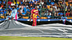 India Vs West Indies Highlights, 5th T20I: Rain Washes Out Bengaluru Decider As Series Ends 2-2 (AP Photo/Aijaz Rahi) : West Indies' Rovman Powell leaves the field as groundsmen cover the playing surface as rain disrupts play during the fifth T20 cricket match between India and West Indies in Bengaluru, India, Saturday, Oct. 17, 2026
