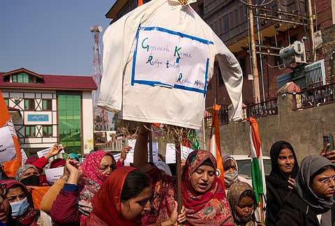 Congress party workers carry an effigy of India's election chief Gyanesh Kumar during a protest in Srinagar, Saturday, Oct. 17, 2026. 
