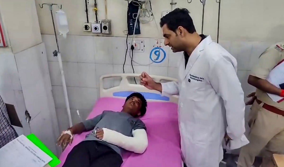 An injured person being treated at a hospital after a minibus veered off the road and fell into a 15-foot-deep drain on the Delhi-Mumbai Expressway, in Kota district - PTI