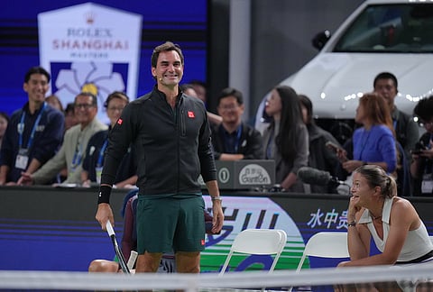 Former tennis players Roger Federer, of Switzerland, and Dinara Safina, of Russia react as they play at the Roger and Friends Celebrity Doubles Match with Chinese celebrities during the Shanghai Masters tennis tournament in Shanghai, China, Friday, Oct. 16, 2026. 
