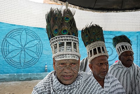 Members of the Ramnami community, a Hindu devotional sect from Chhattisgarh, are seen at a community puja pandal during the ongoing 'Durga Puja' festival, in Kolkata, West Bengal, Saturday, Oct. 17, 2026. 
