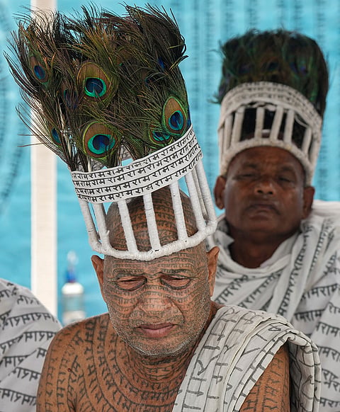 Members of the Ramnami community, a Hindu devotional sect from Chhattisgarh, are seen at a community puja pandal during the ongoing 'Durga Puja' festival, in Kolkata, West Bengal, Saturday, Oct. 17, 2026.
