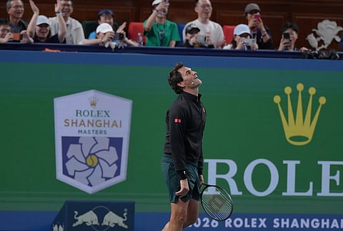 Former tennis player Roger Federer, of Switzerland reacts as he plays at the Roger and Friends Celebrity Doubles Match with Marat Safin, former tennis player Dinara Safina, of Russia and Chinese celebrities during the Shanghai Masters tennis tournament in Shanghai, China, Friday, Oct. 16, 2026. 
