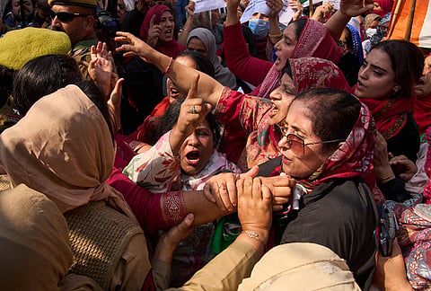 Policewomen stop Congress party workers during a protest in Srinagar, Saturday, Oct. 17, 2026. The Congress party workers were demanding the resignation of India's election chief as well as protesting against an administrative officer who allegedly abused a female colleague during a virtual meeting. 
