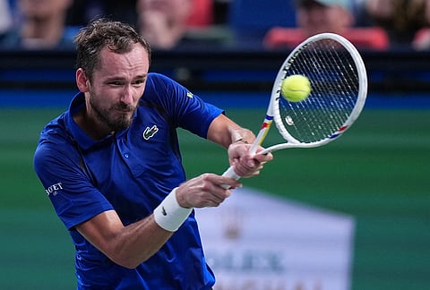 Russia's Daniil Medvedev returns a ball to United States' Tommy Paul during the men's singles quarterfinals match at the Shanghai Masters tennis tournament in Shanghai, China, Friday, Oct. 16, 2026.