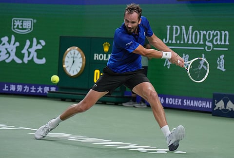 Russia's Daniil Medvedev returns a ball to United States' Tommy Paul during the men's singles quarterfinals match at the Shanghai Masters tennis tournament in Shanghai, China, Friday, Oct. 16, 2026. 