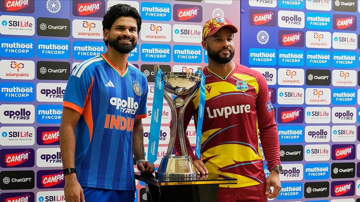India's captain Shreyas Iyer and West Indies' captain Shai Hope, right, pose with the winners' trophy after the five-match T20 cricket series between the two countries concluded in a draw, in Bengaluru, India, Saturday, Oct. 17, 2026 - (AP Photo/Aijaz Rahi)