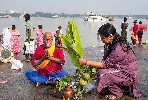 People perform 'Kola Bou' rituals on the bank of the Ganga river at a ghat, on the occasion of 'Maha Saptami' during the ongoing 'Durga Puja' festival, in Kolkata, West Bengal, Saturday, Oct. 17, 2026. 
