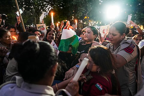 All India Mahila Congress President Alka Lamba being detained by police and security personnel during a protest demanding justice for the 2022 murder of 19-year-old Ankita Bhandari in Uttarakhand, at Connaught Place, in New Delhi, Sunday, Oct. 18, 2026.