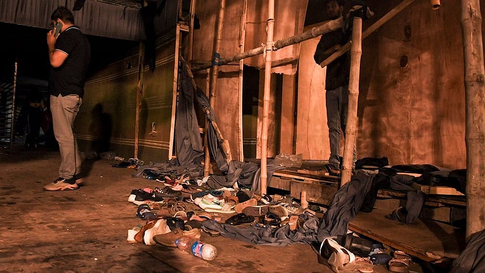 Footwear lies scattered outside a Durga Puja pandal after the exit gate collapsed due to heavy crowd pressure, leading to a stampede-like situation in Kolkata
 - | Photo: PTI 