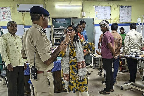 District Magistrate Ruchika Chauhan meets injured people at a hospital after a truck crashed into several devotees waiting near a temple, killing thirteen people and injuring nearly 40 others, in Madhya Pradesh's Gwalior city.