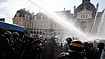 Limoges Town Hall Destroyed In Fire Amid France Protests; JD Vance Blames ‘Western Liberals’ | Photo: AP/Jeremias Gonzalez : Riot police use a water cannon as they face students during a protest against under-resourced schools, in Rennes, western France