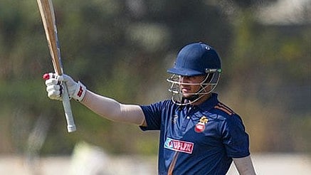 Delhi's Priyansh Arya celebrates his half century during the Vijay Hazare Trophy 2025-26 cricket match between Andhra and Delhi, at BCCI Centre of Excellence Ground, in Bengaluru. - Photo: PTI/Shailendra Bhojak