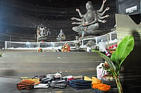 In Photos: Scattered Shoes, Abandoned Belongings After Kolkata Pandal Stampede | Photo: AP : Purses and other belongings left behind by devotees lie on the floor of a worship venue for the Hindu festival of Durga Puja following a stampede, in Kolkata, India, Saturday, Oct. 17, 2026.