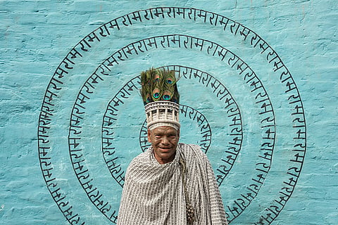 A member of the Ramnami community, a Hindu devotional sect from Chhattisgarh, is seen at a community puja pandal during the ongoing 'Durga Puja' festival, in Kolkata, West Bengal. The community members tattoo the sacred name 'Ram' on their skin, transforming their bodies into living temples, as an act of rebellion against discrimination by the higher castes.